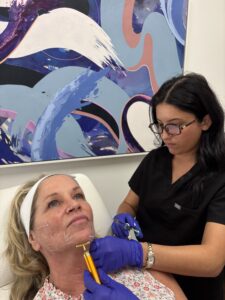 Isabelle working with Kathi on skincare goals.