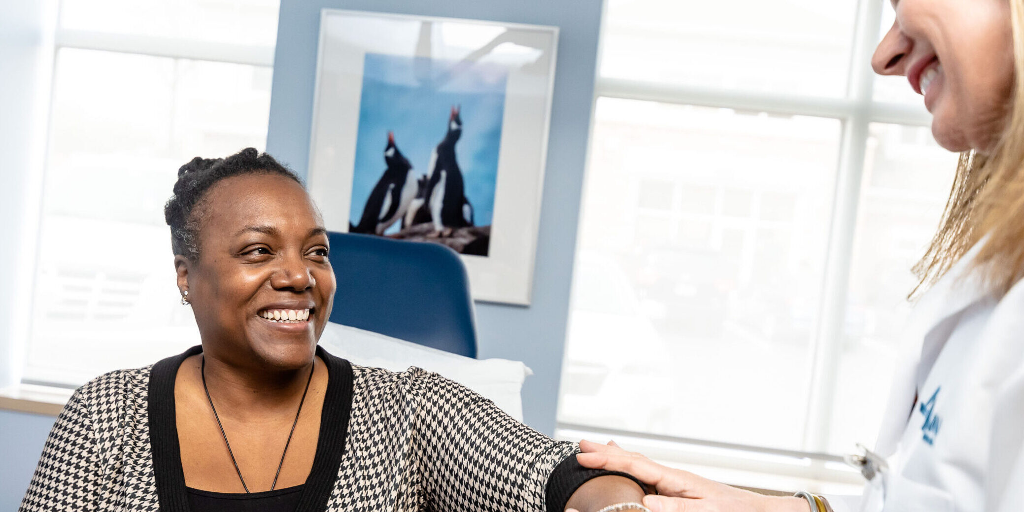 Apex Dermatologist giving patient annual skin exam.