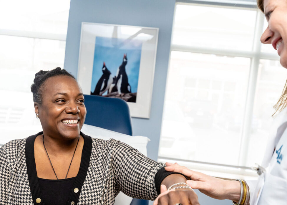 Apex Dermatologist giving patient annual skin exam.